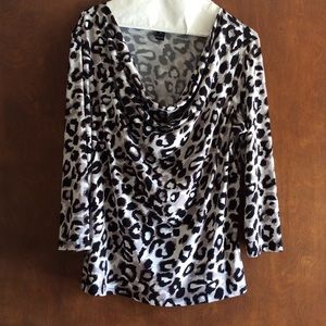 Animal print top with draped neckline.